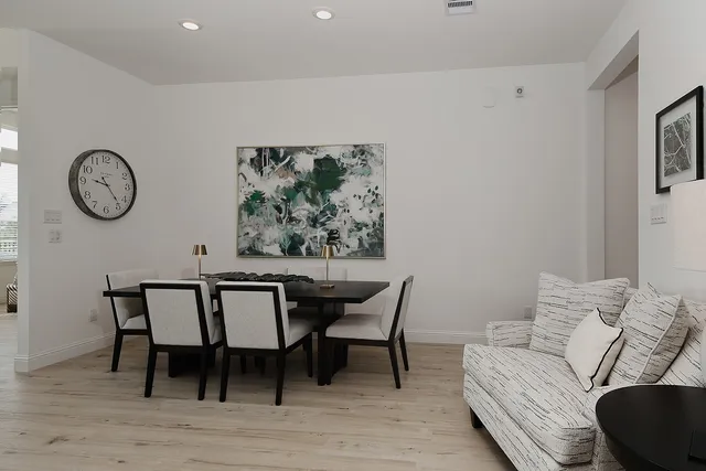 a view of a livingroom with furniture and wooden floor