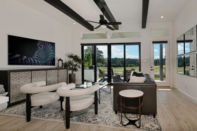 a view of a livingroom with furniture and window