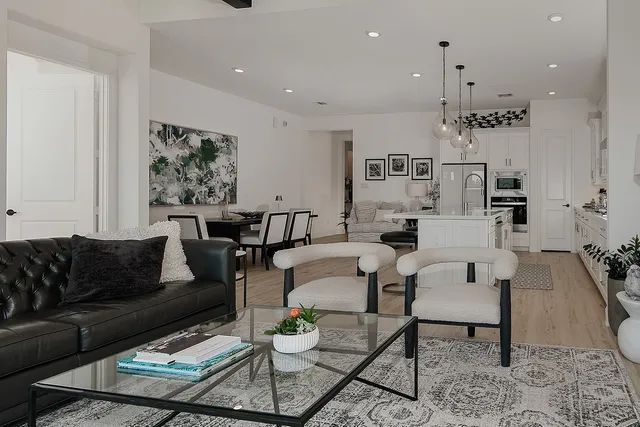 a living room with furniture and a rug
