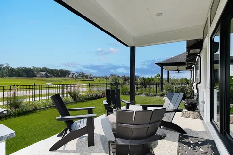 a view of a chair and tables in the patio
