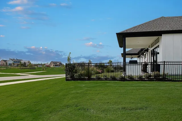 a view of a house with a big yard