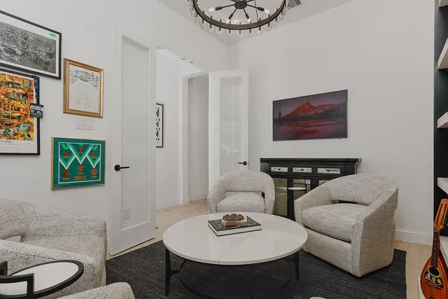 a living room with furniture and a table
