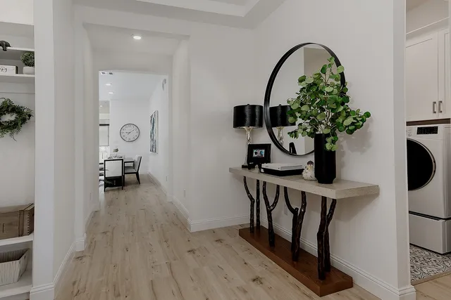 a view of living room with furniture and wooden floor