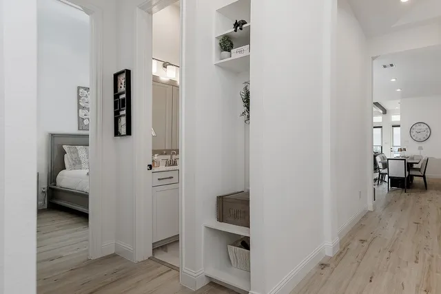 a view of living room and wooden floor
