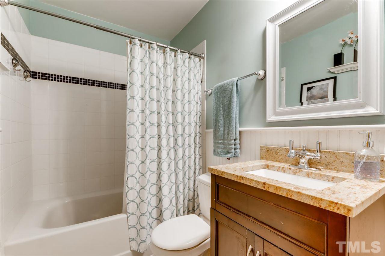 1405 Geneva Street Raleigh, NC 27606 - Photo 14 of 30 a bathroom with a sink toilet and shower
