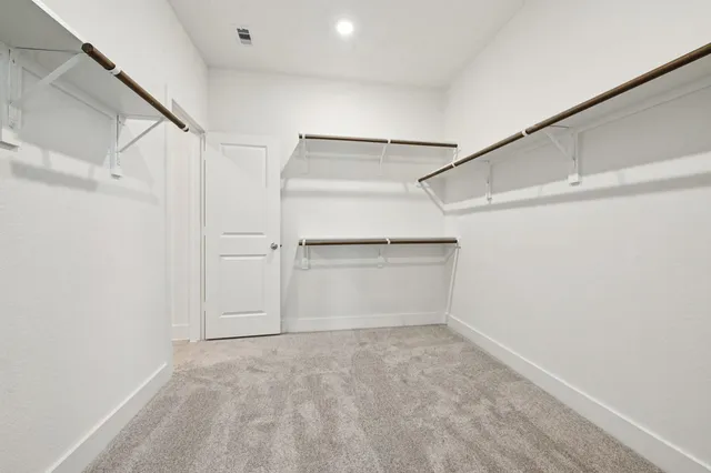 a view of a bathroom with a sink and mirror