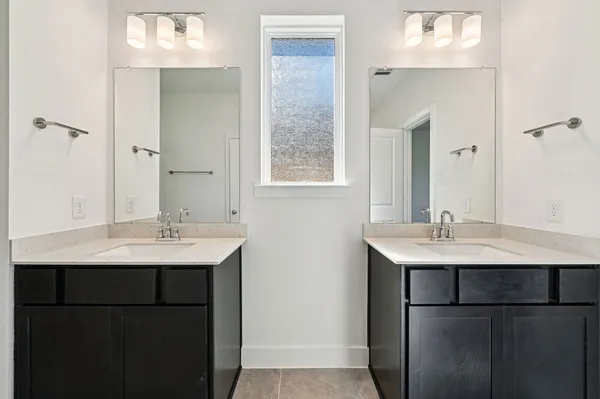a large kitchen with stainless steel appliances granite countertop a sink a stove and a refrigerator