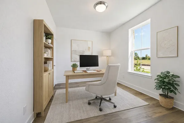 a workspace with furniture window and wooden floor