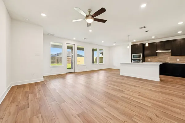 an empty room with closet and a bathroom