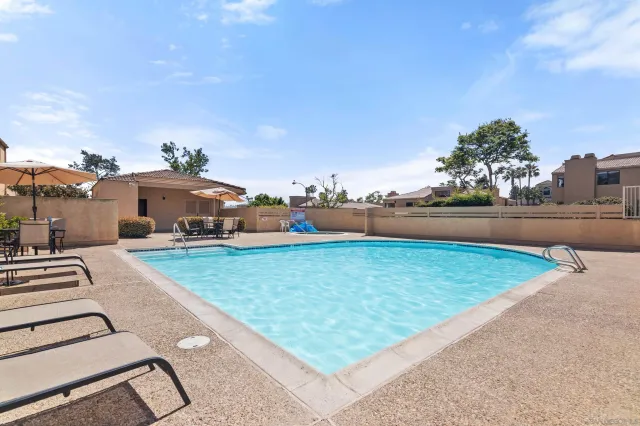 a view of a yard with an outdoor seating