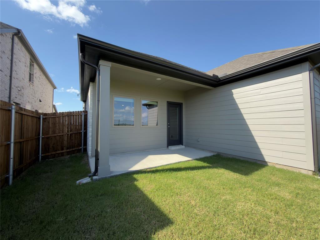120 Millwood Road Lavon, TX 75166 - Photo 31 of 34 Covered patio with concrete flooring, overlooking a green lawn