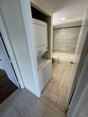 a bathroom with a sink a toilet and tub