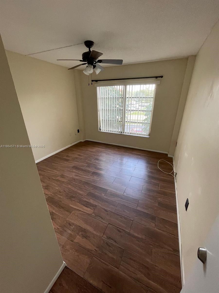 4164 Inverrary Drive, Unit 215 Lauderhill, FL 33319 - Photo 12 of 27 a view of an empty room with a window