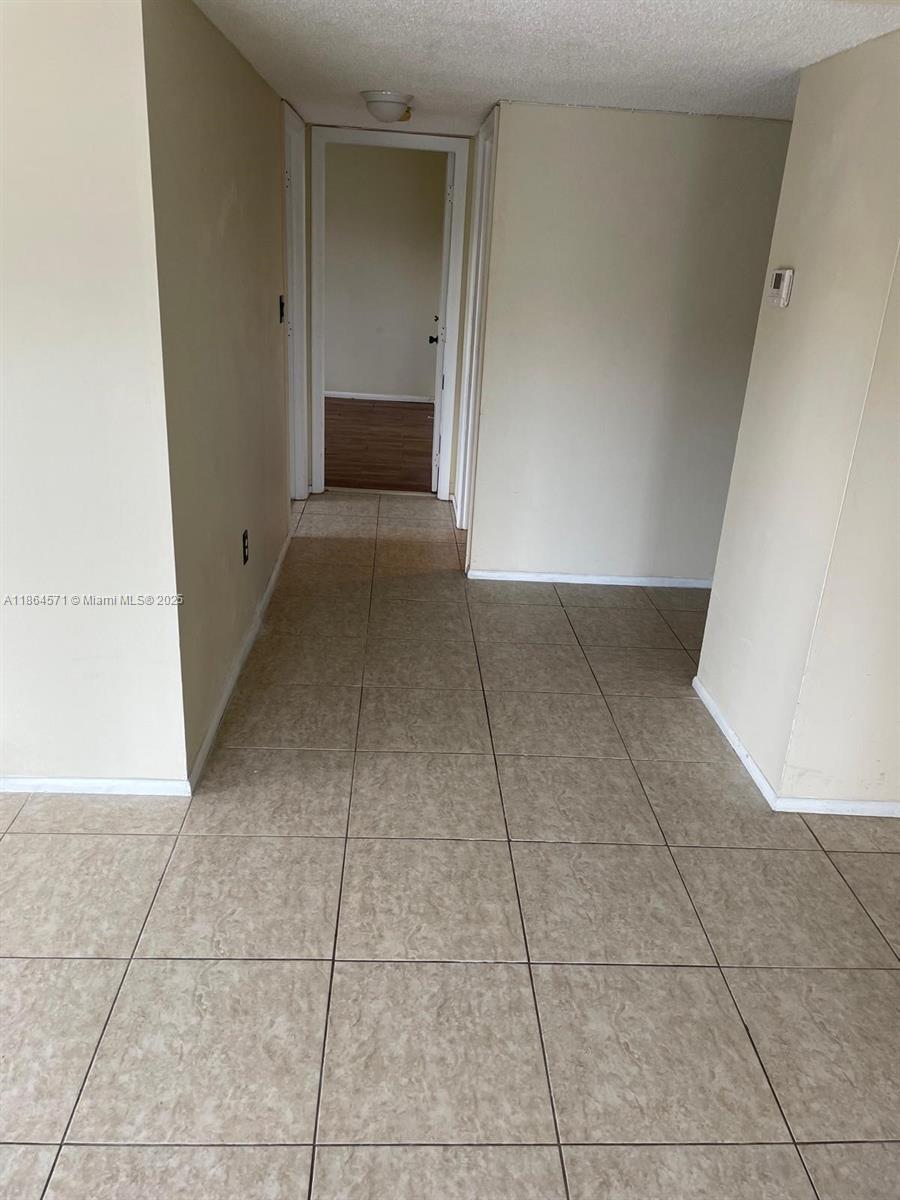 4164 Inverrary Drive, Unit 215 Lauderhill, FL 33319 - Photo 13 of 27 a view of livingroom with hallway