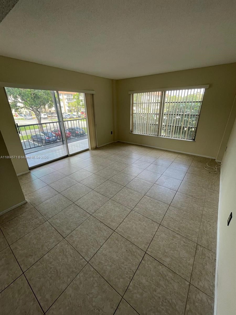 4164 Inverrary Drive, Unit 215 Lauderhill, FL 33319 - Photo 15 of 27 a view of an empty room with a window