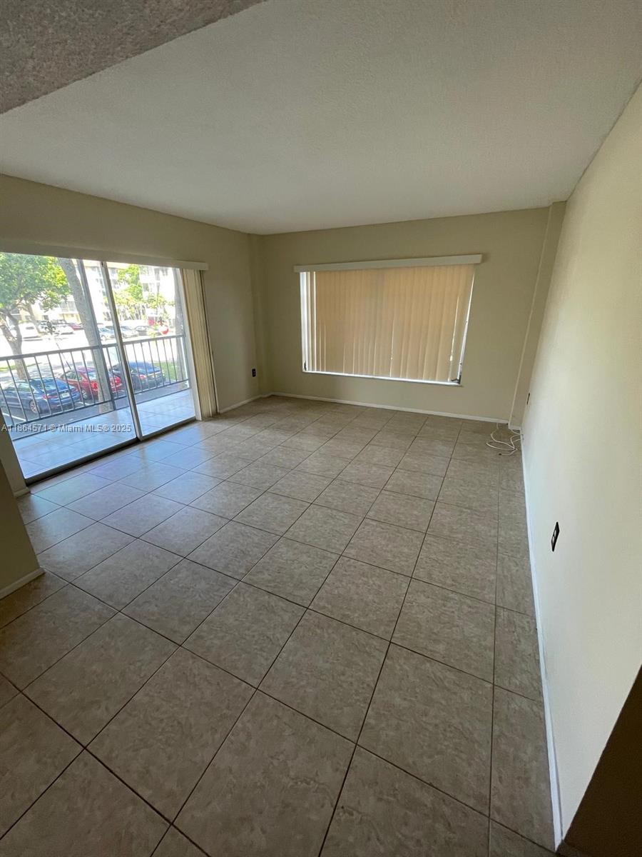 4164 Inverrary Drive, Unit 215 Lauderhill, FL 33319 - Photo 16 of 27 a view of an empty room with a window