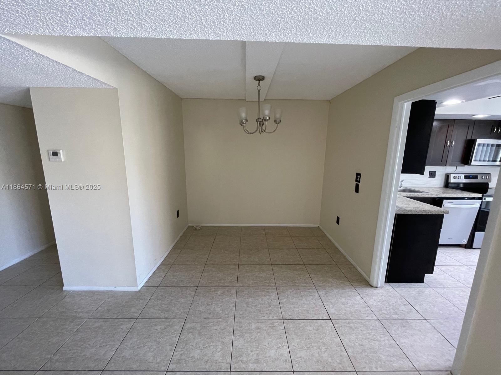 4164 Inverrary Drive, Unit 215 Lauderhill, FL 33319 - Photo 17 of 27 a view of a kitchen with a sink and dishwasher
