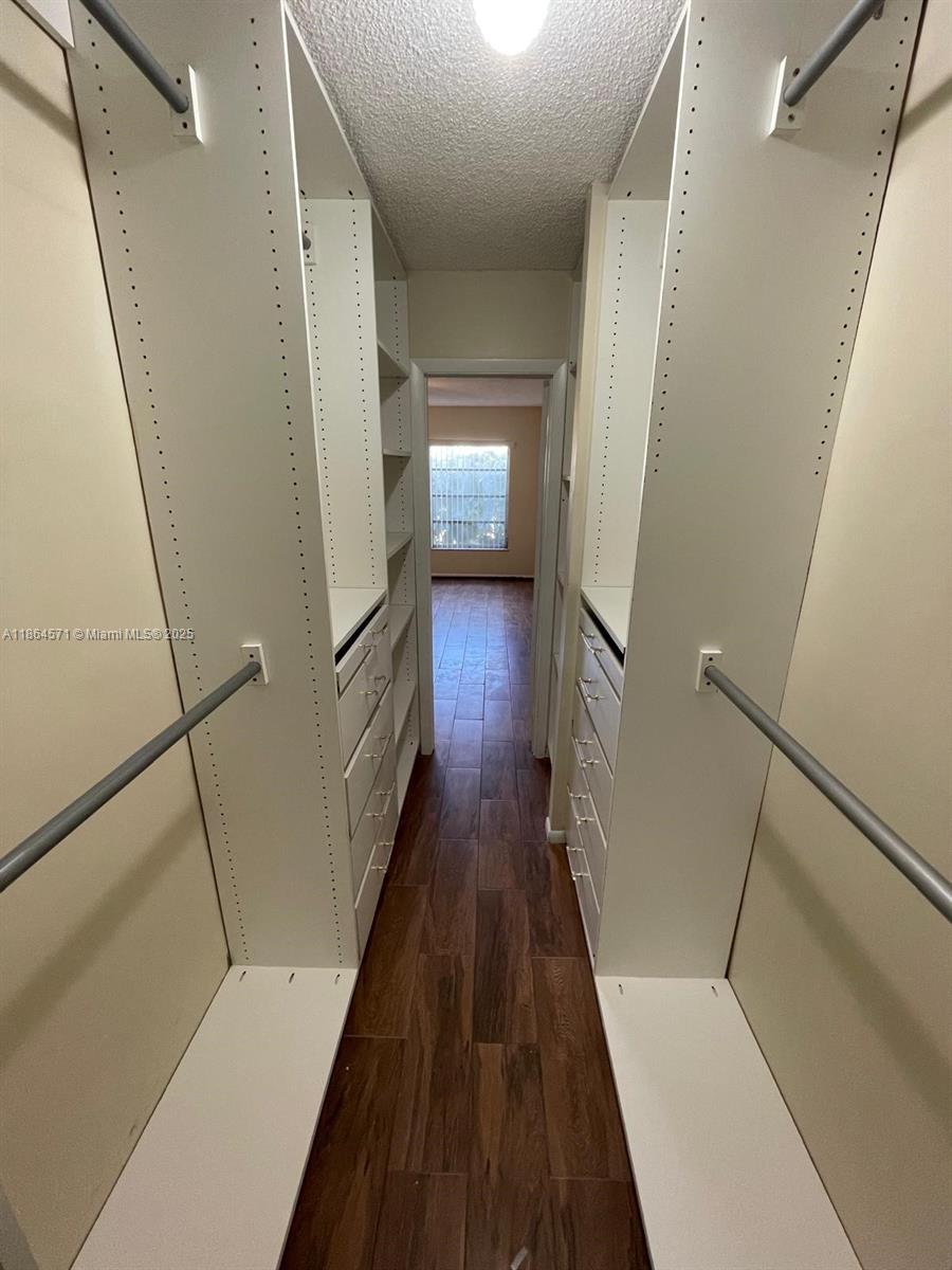 4164 Inverrary Drive, Unit 215 Lauderhill, FL 33319 - Photo 18 of 27 a view of staircase with wooden floor and railing