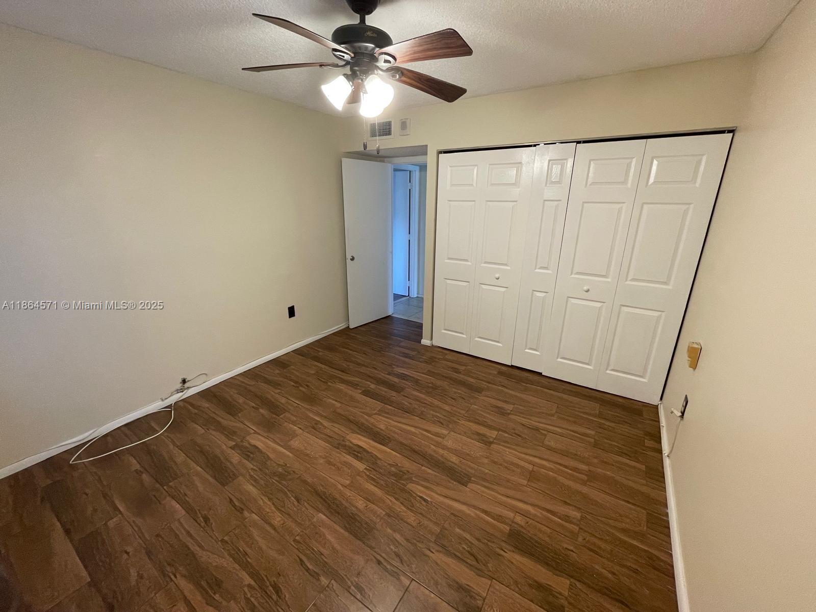 4164 Inverrary Drive, Unit 215 Lauderhill, FL 33319 - Photo 22 of 27 wooden floor in an empty room