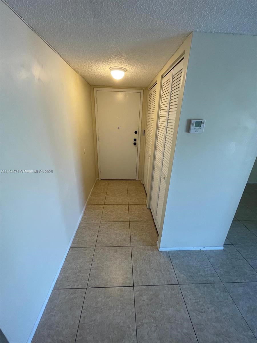 4164 Inverrary Drive, Unit 215 Lauderhill, FL 33319 - Photo 25 of 27 a view of hallway with door