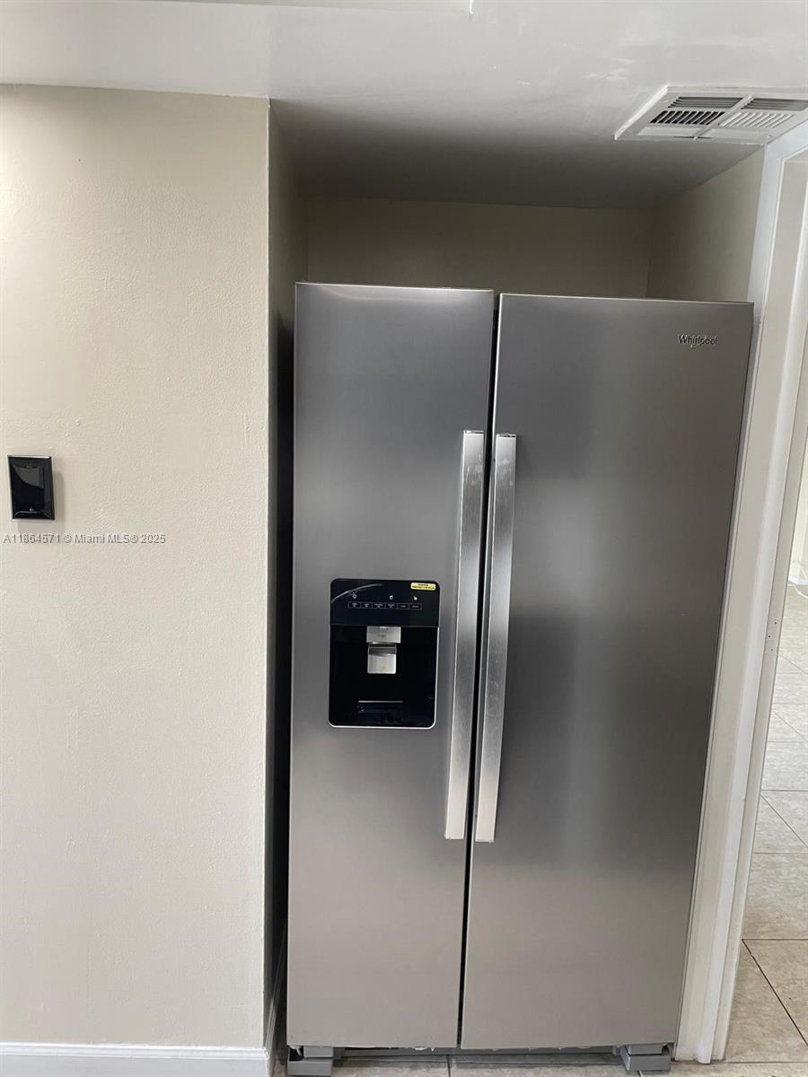 4164 Inverrary Drive, Unit 215 Lauderhill, FL 33319 - Photo 4 of 27 a view of a refrigerator in kitchen
