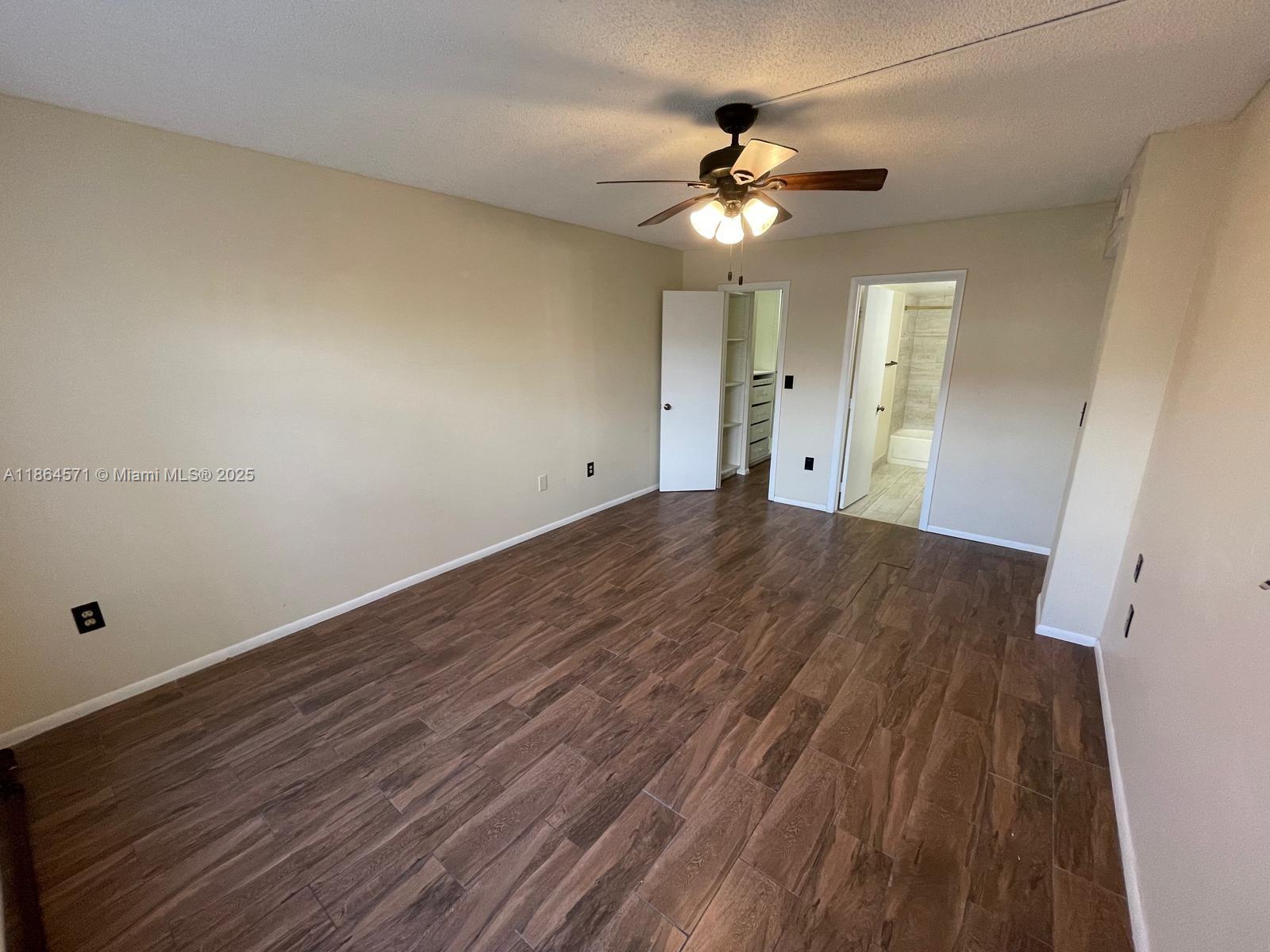 4164 Inverrary Drive, Unit 215 Lauderhill, FL 33319 - Photo 7 of 27 a view of a livingroom with wooden floor