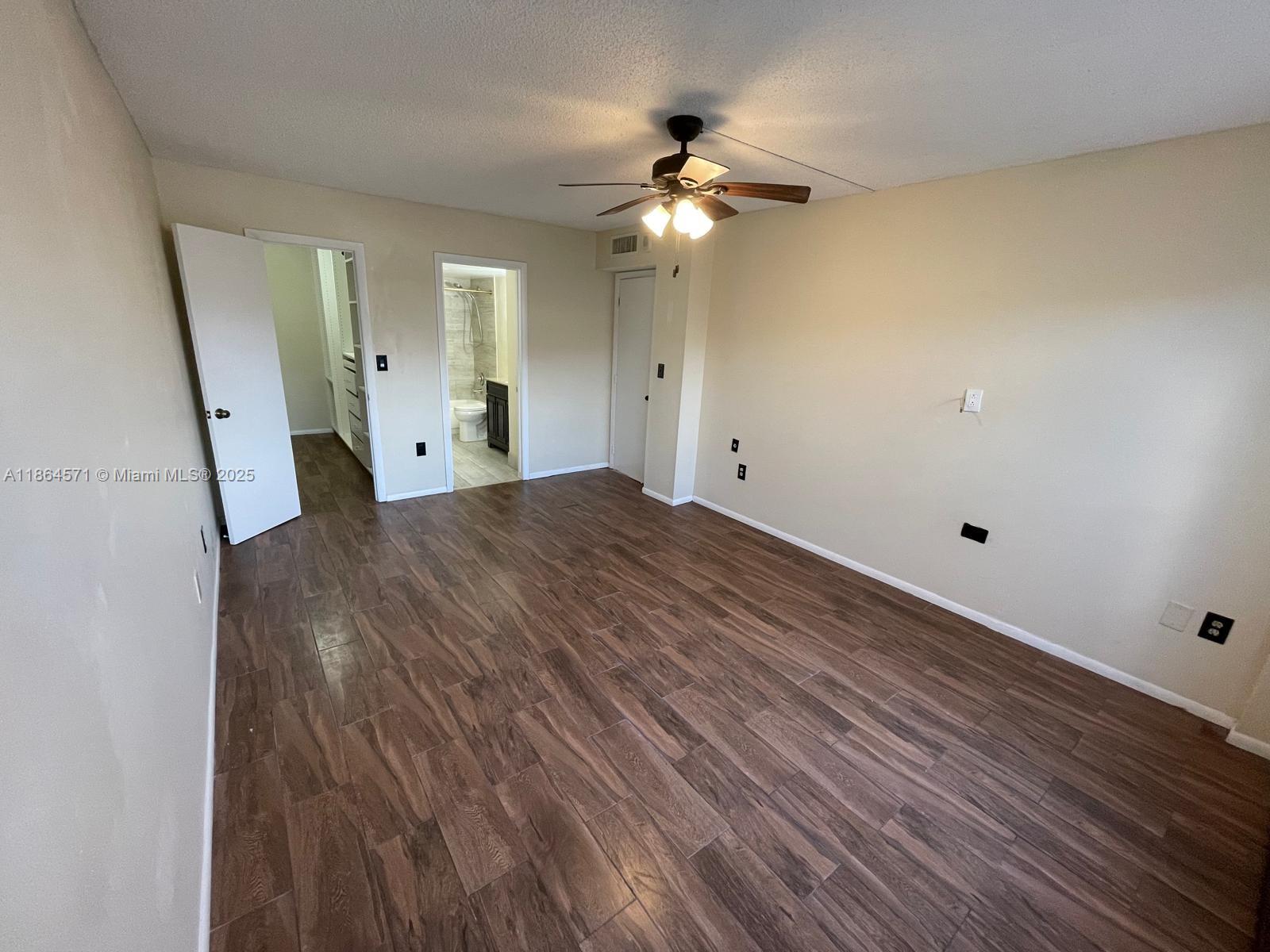 4164 Inverrary Drive, Unit 215 Lauderhill, FL 33319 - Photo 9 of 27 a view of a livingroom with wooden floor