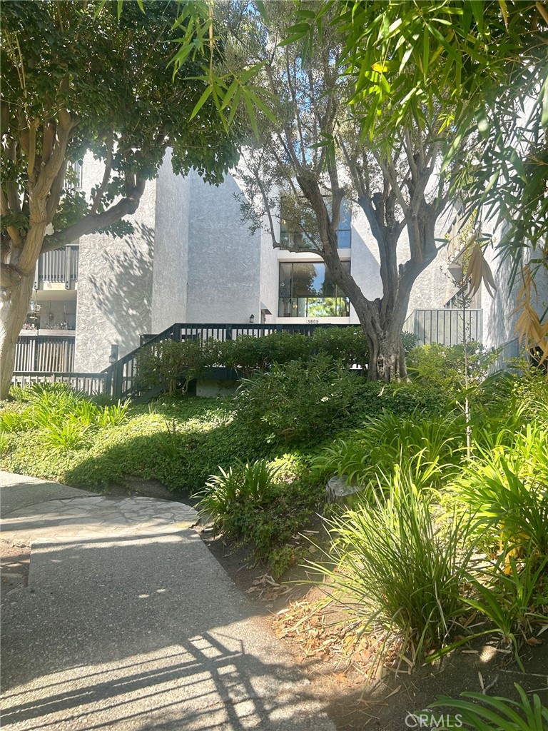 3605 West Hidden Lane, Unit 309 Rolling Hills Estates, CA 90274 - Photo 1 of 37 a front view of a house with garden