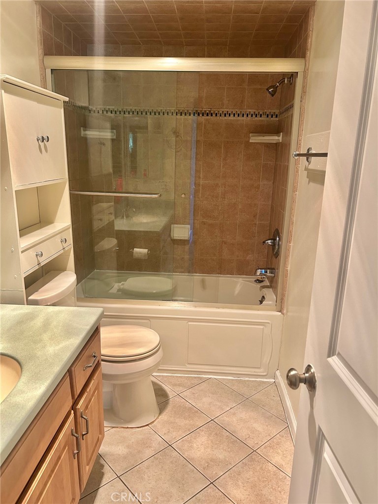 3605 West Hidden Lane, Unit 309 Rolling Hills Estates, CA 90274 - Photo 11 of 37 a bathroom with a granite countertop bathtub shower sink and toilet