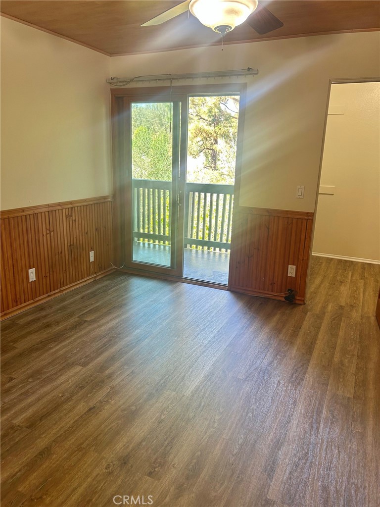 3605 West Hidden Lane, Unit 309 Rolling Hills Estates, CA 90274 - Photo 15 of 37 a view of an empty room with wooden floor and a window