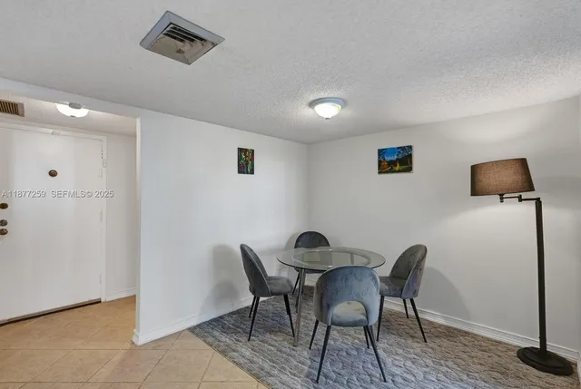 a kitchen with a stove and a refrigerator