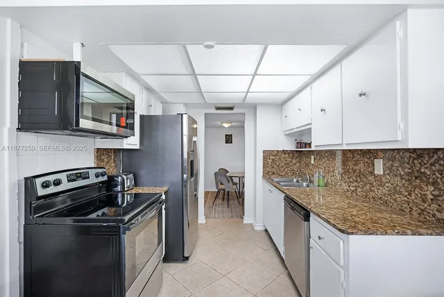 a kitchen with a stove and a microwave