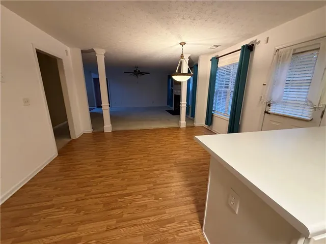 a view of a hallway with furniture