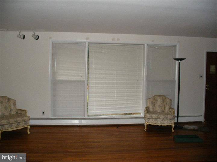 206 East Providence Road Yeadon, PA 19050 - Photo 5 of 25 a room with wooden floor and a window