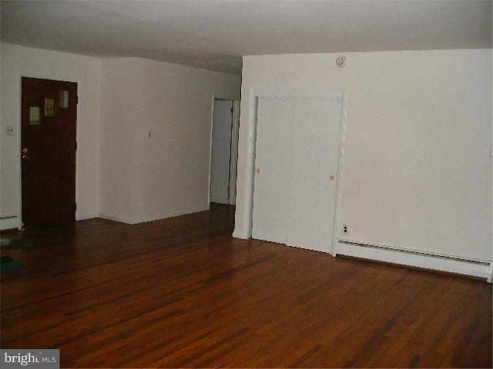 206 East Providence Road Yeadon, PA 19050 - Photo 6 of 25 a view of an empty room with wooden floor
