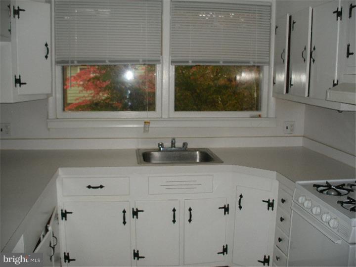 206 East Providence Road Yeadon, PA 19050 - Photo 9 of 25 a bathroom with a sink a vanity and a mirror