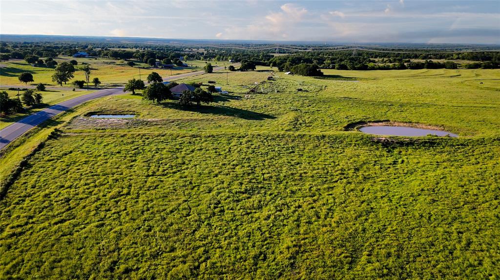 18100 Farm To Market 920 Poolville, TX 76487 - Photo 5 of 32 a view of a city and ocean view