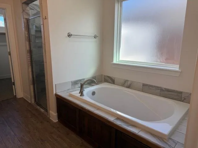a bath tub sitting next to a white sink