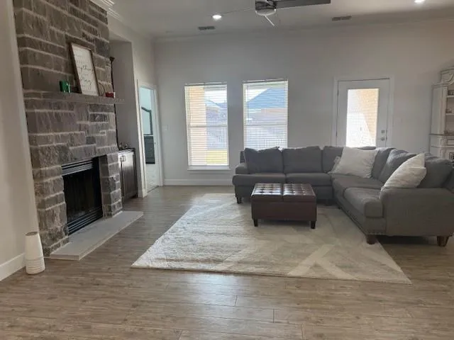 a living room with furniture and a fireplace