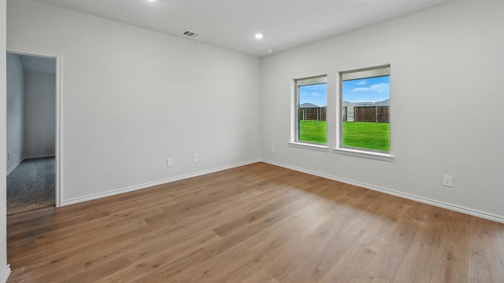 511 Lantana Road Princeton, TX 75407 - Photo 29 of 35 wooden floor in an empty room with a window