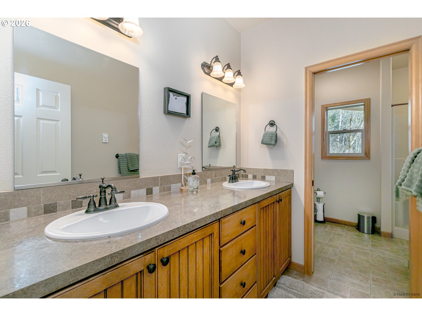 64636 Mc Intyre Road Rhododendron, OR 97049 - Photo 23 of 48 a bathroom with a sink double vanity granite and a mirror