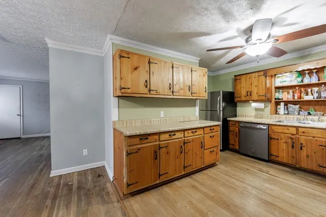 a kitchen with stainless steel appliances granite countertop a stove and a sink