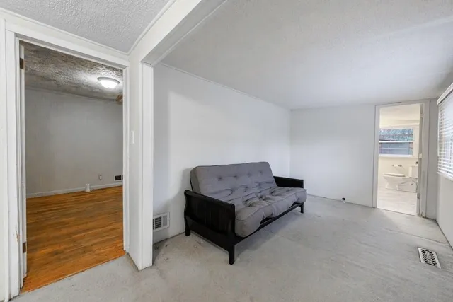 a living room with furniture and a table