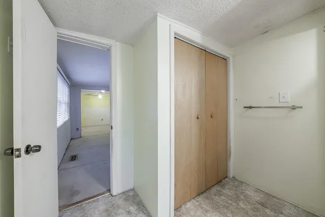 a view of a livingroom from a hallway