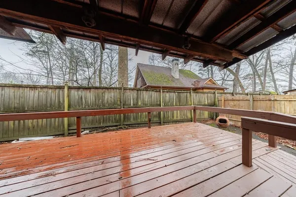 a balcony with wooden floor