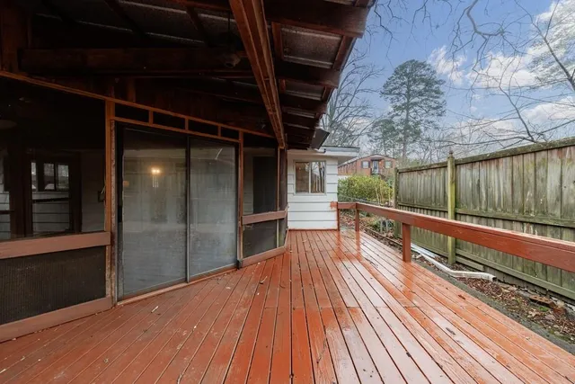 a view of balcony with wooden floor