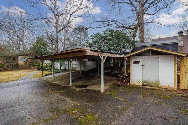 a house with trees in the background