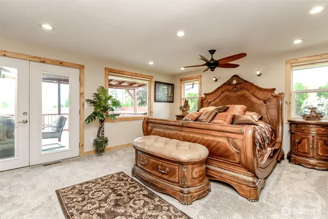 a bed room with a bed and a chandelier