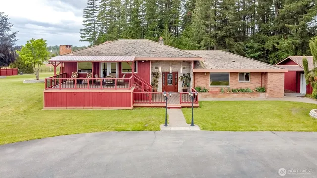 a front view of house with yard and trees