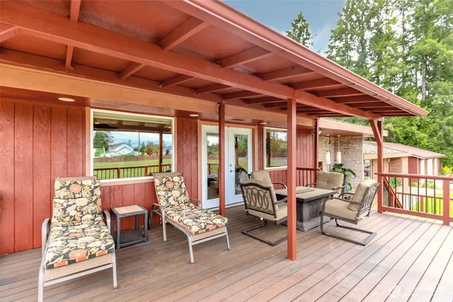 a patio with patio couch and wooden floor